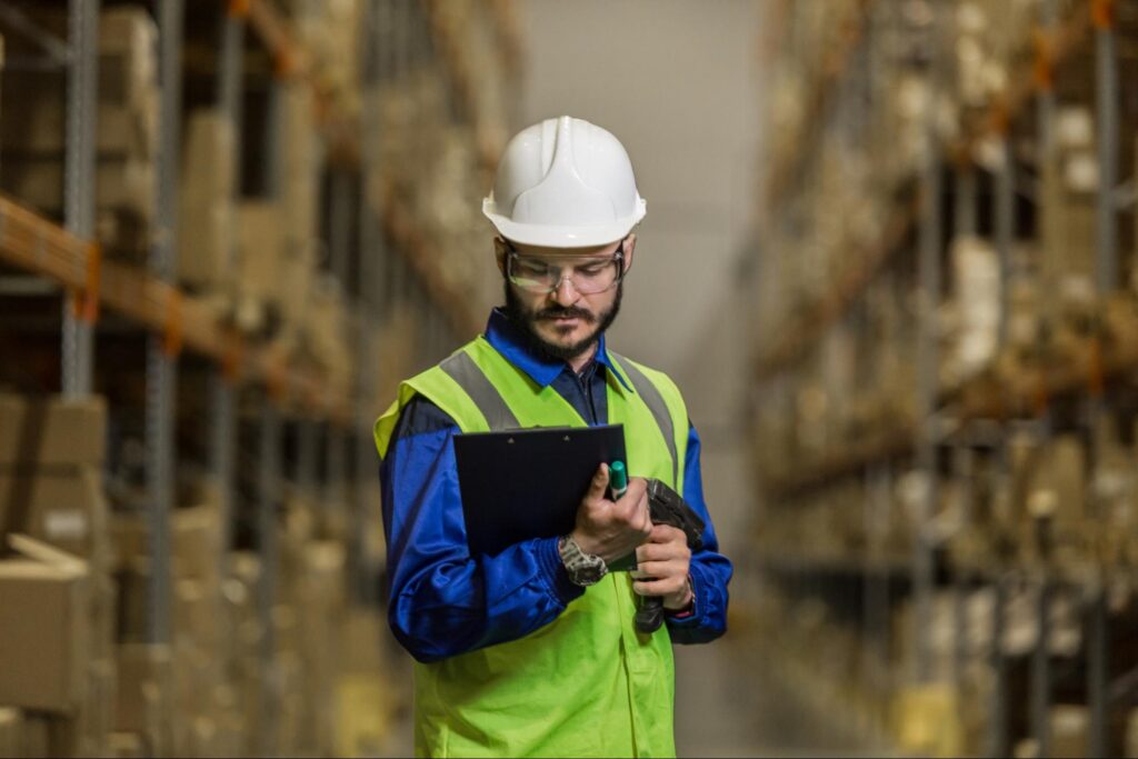 Warehouse worker looking at document