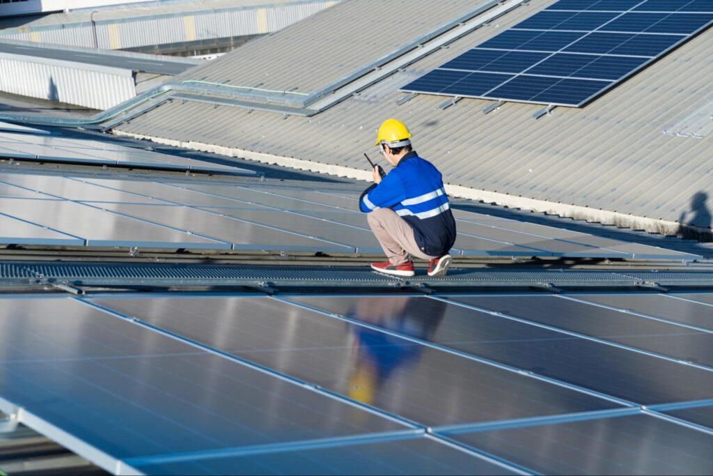 Technician during inspcection of solar panel