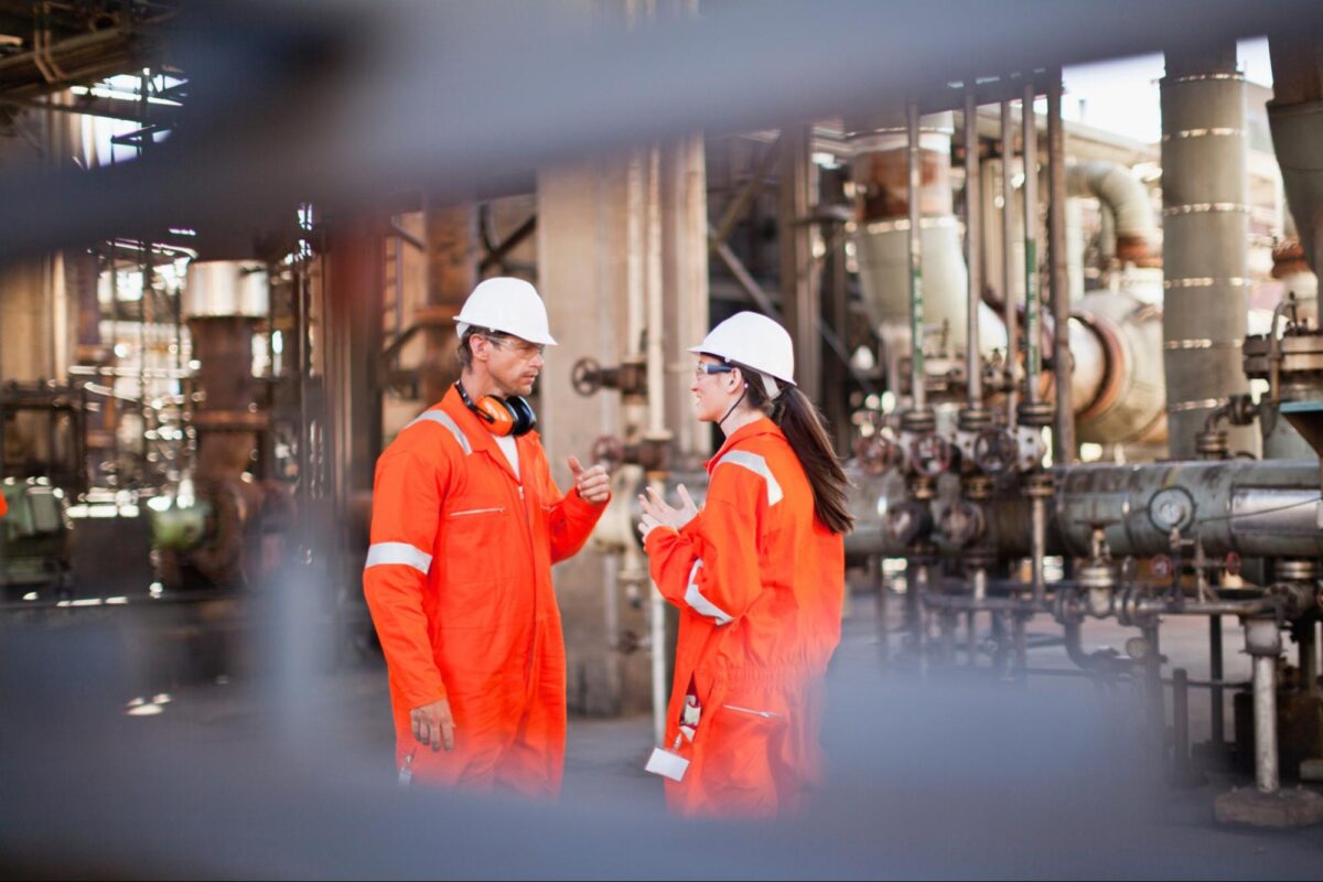 workers-talking-at-oil-refinery