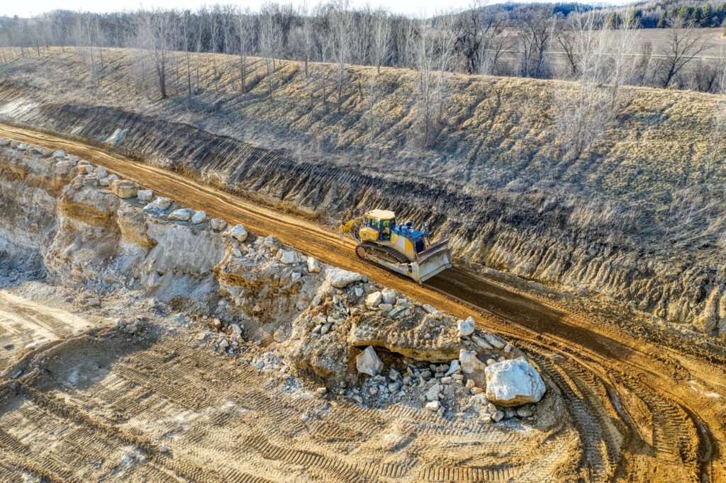 Yellow Bulldozer Working on Coal Mine