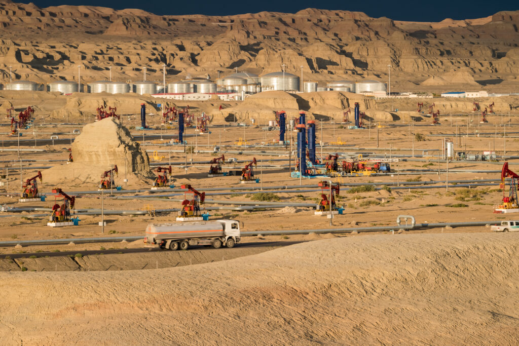 successful inspection in oil operations. gobi oil field operation area closeup, wind erosion landform at dusk , xinjiang, China
