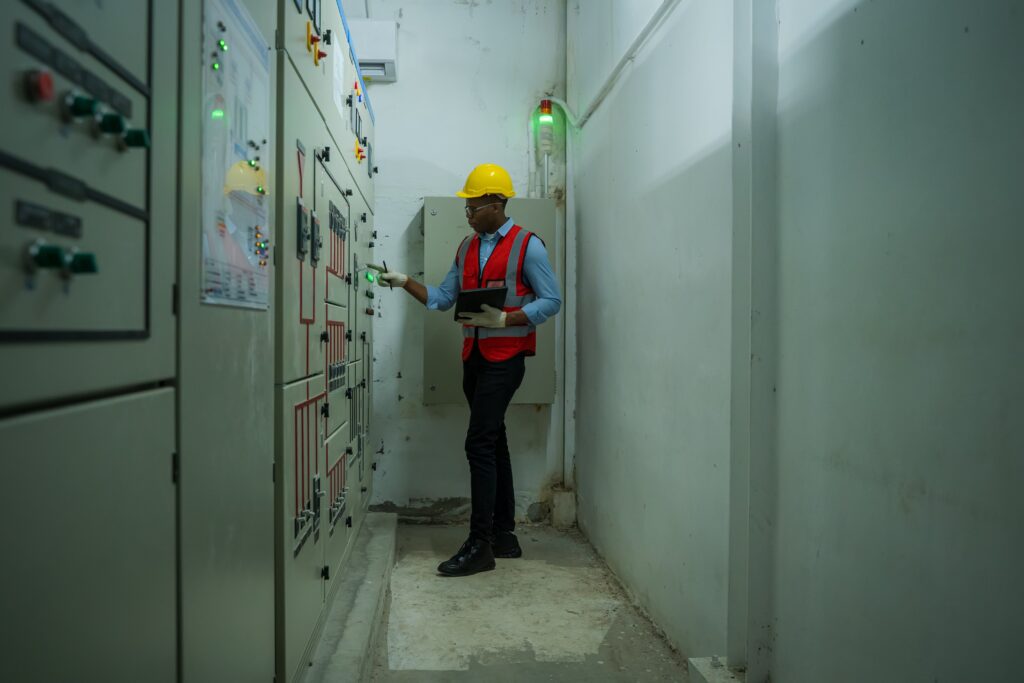 engineer checking electrical panel in a building