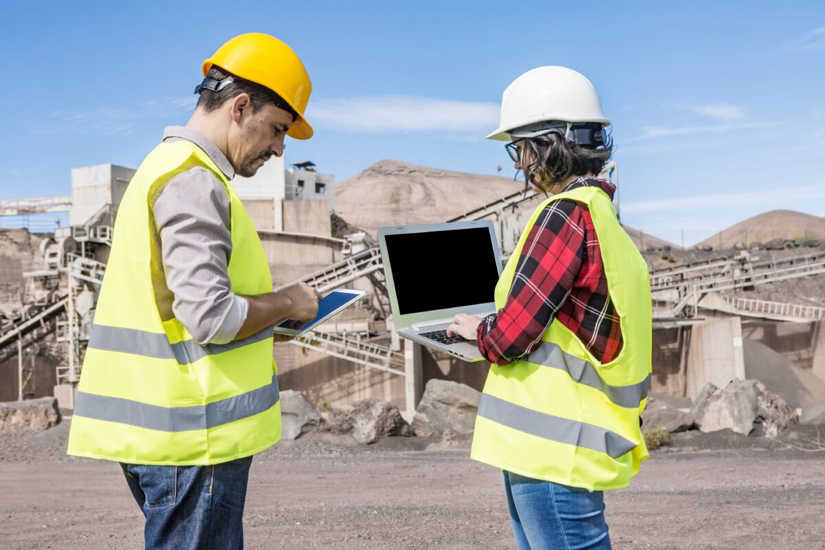 industrial developers working on tablets at work site