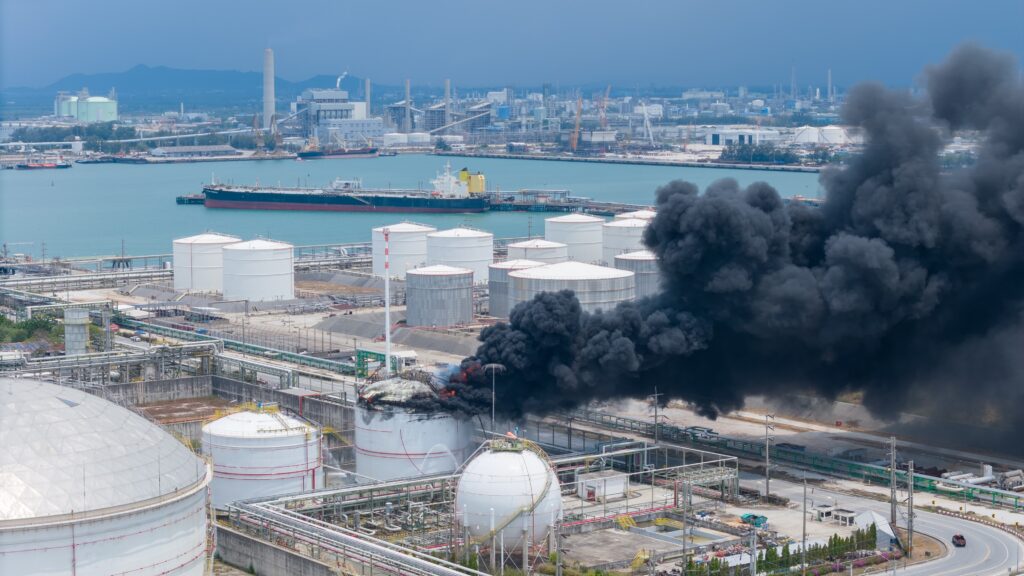 dark smoke rising from gas storage tank explosion
