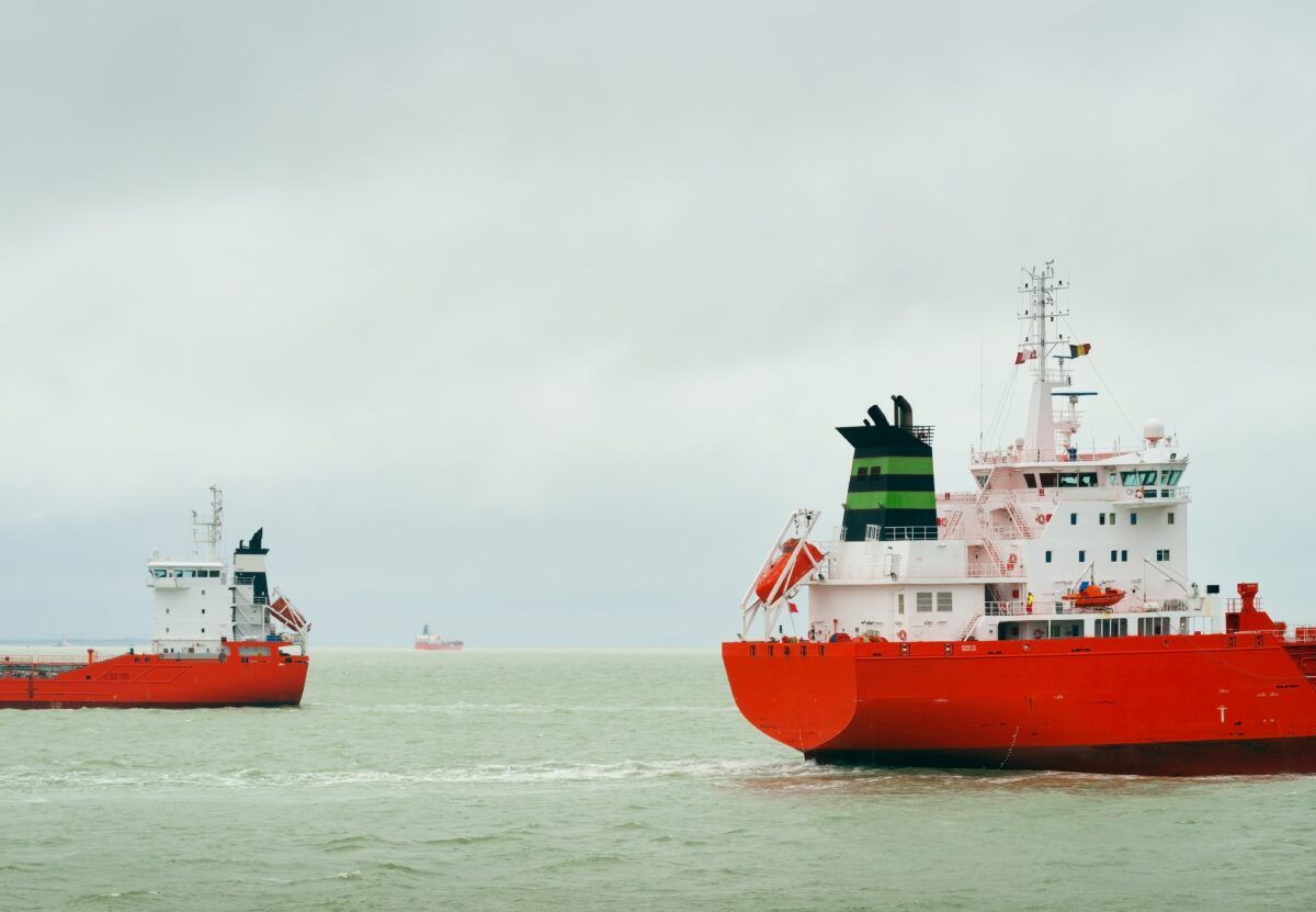 ships with red hull pass each other at sea