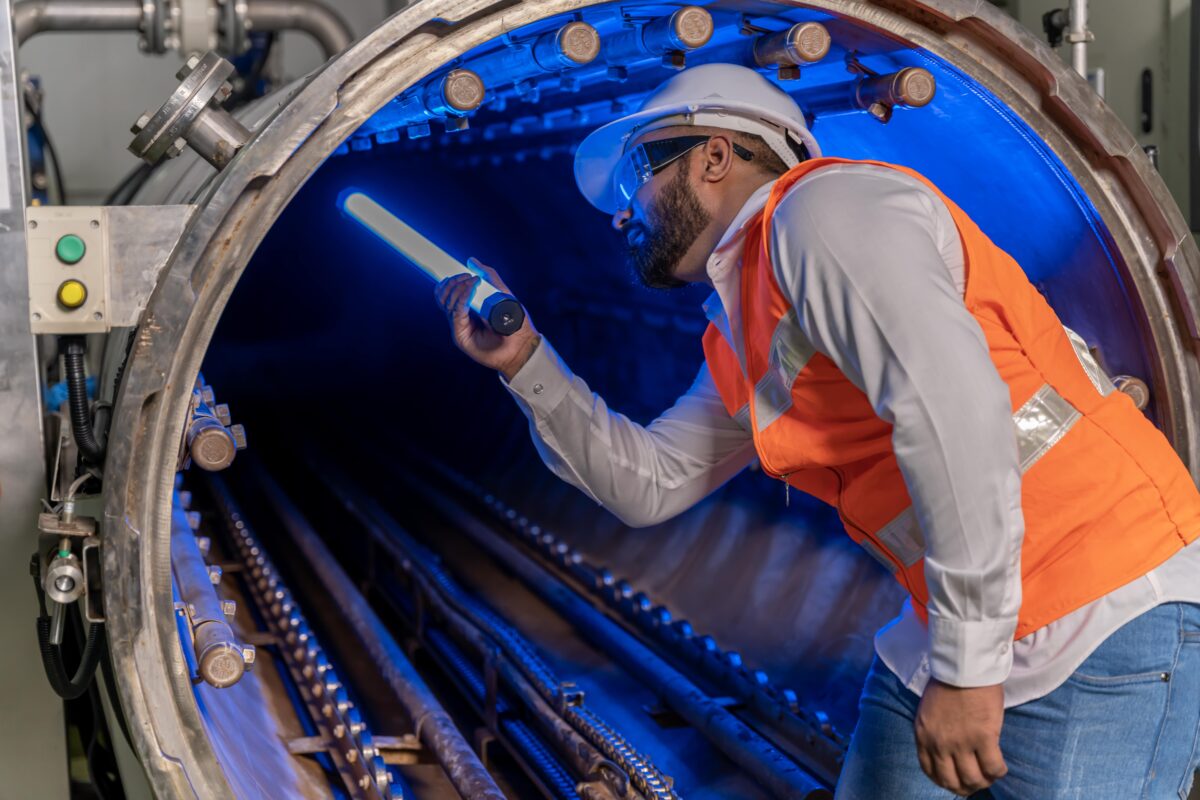 engineer conducting inspection in pipe