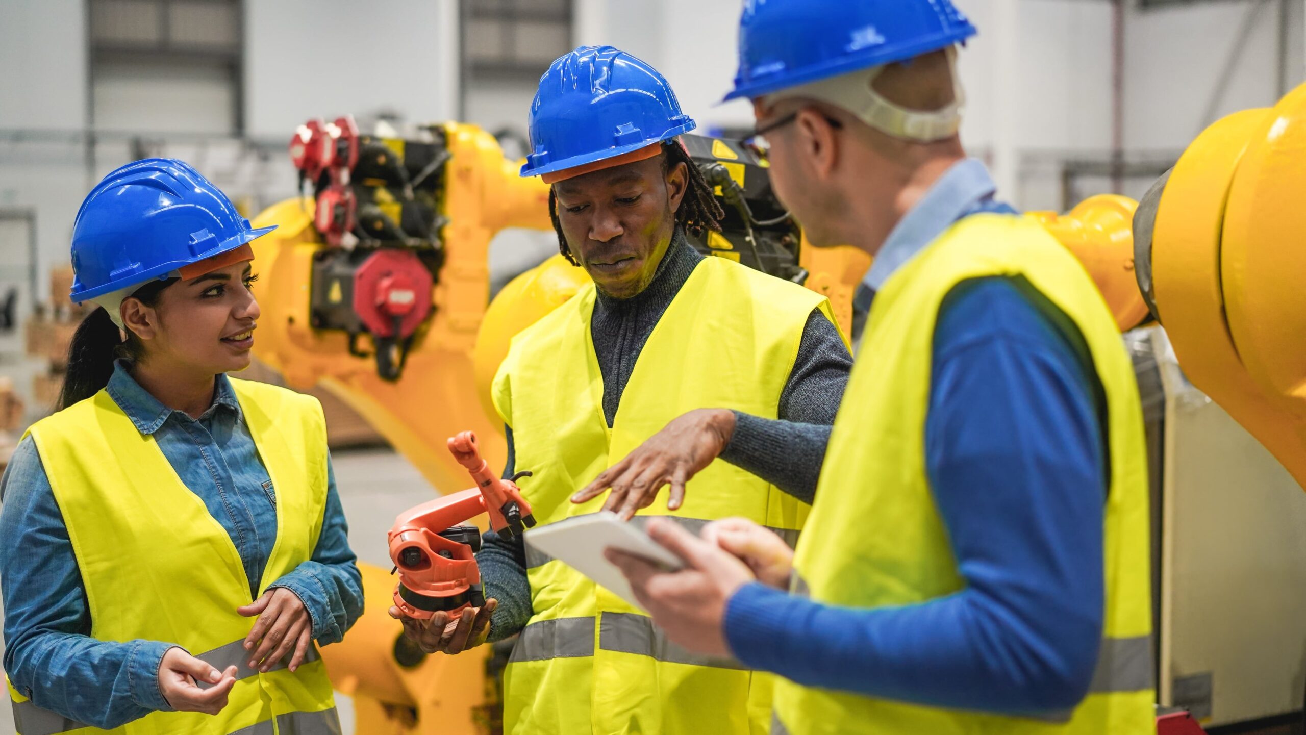 two engineers working inside robotics factory